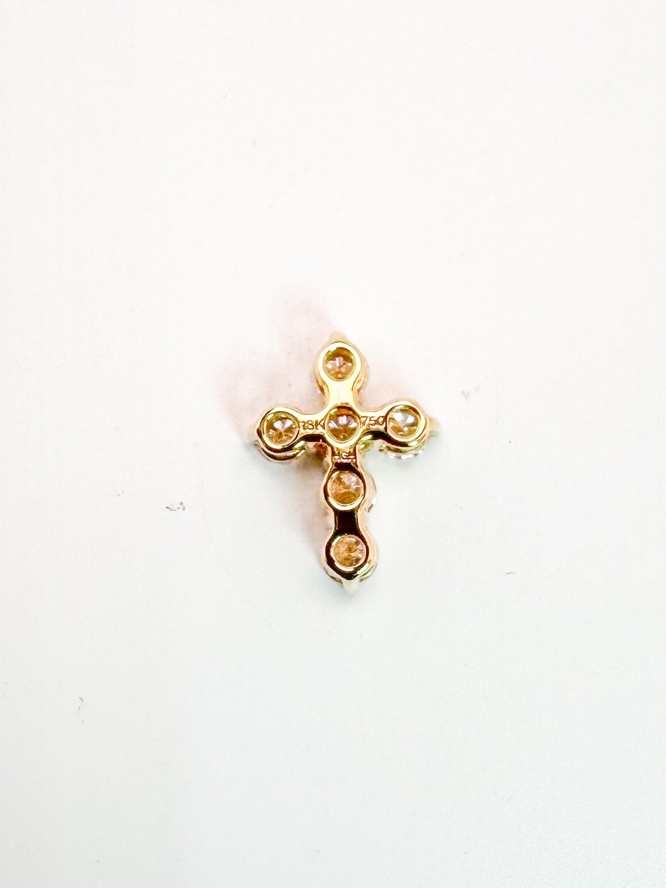 18k,Yellow gold, mini natural diamond cross. .40 carat total weight.