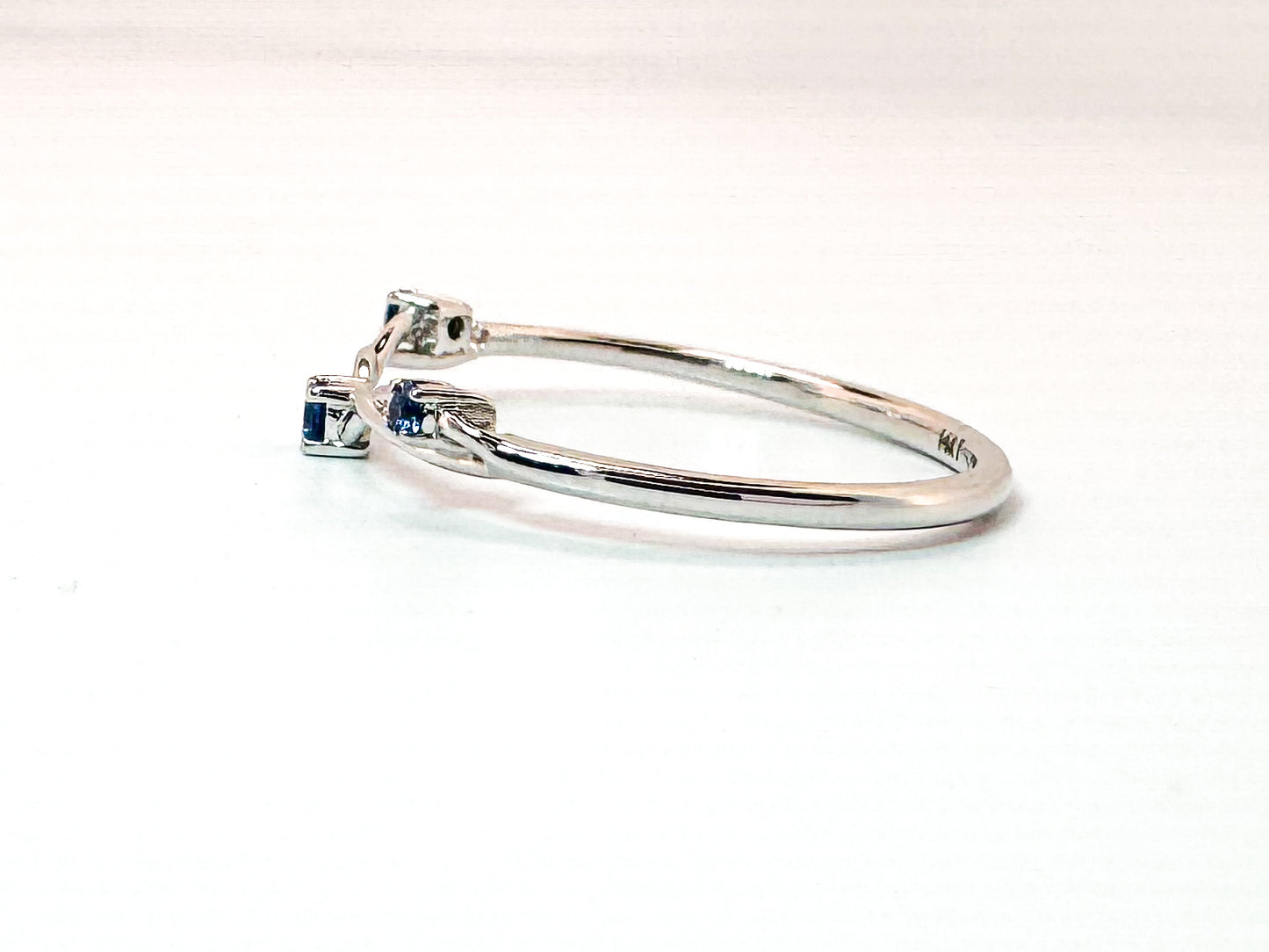 14K, white gold, .07 carat sapphire contour band.
