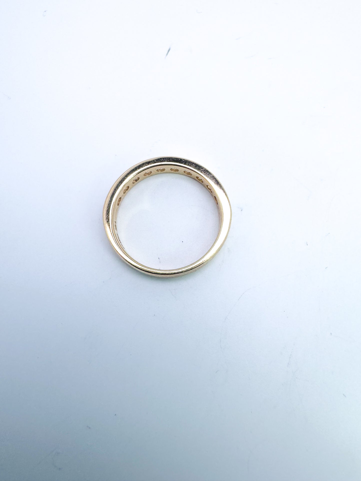 14k, yellow gold channel set natural diamond anniversary band. .75 carat total weight