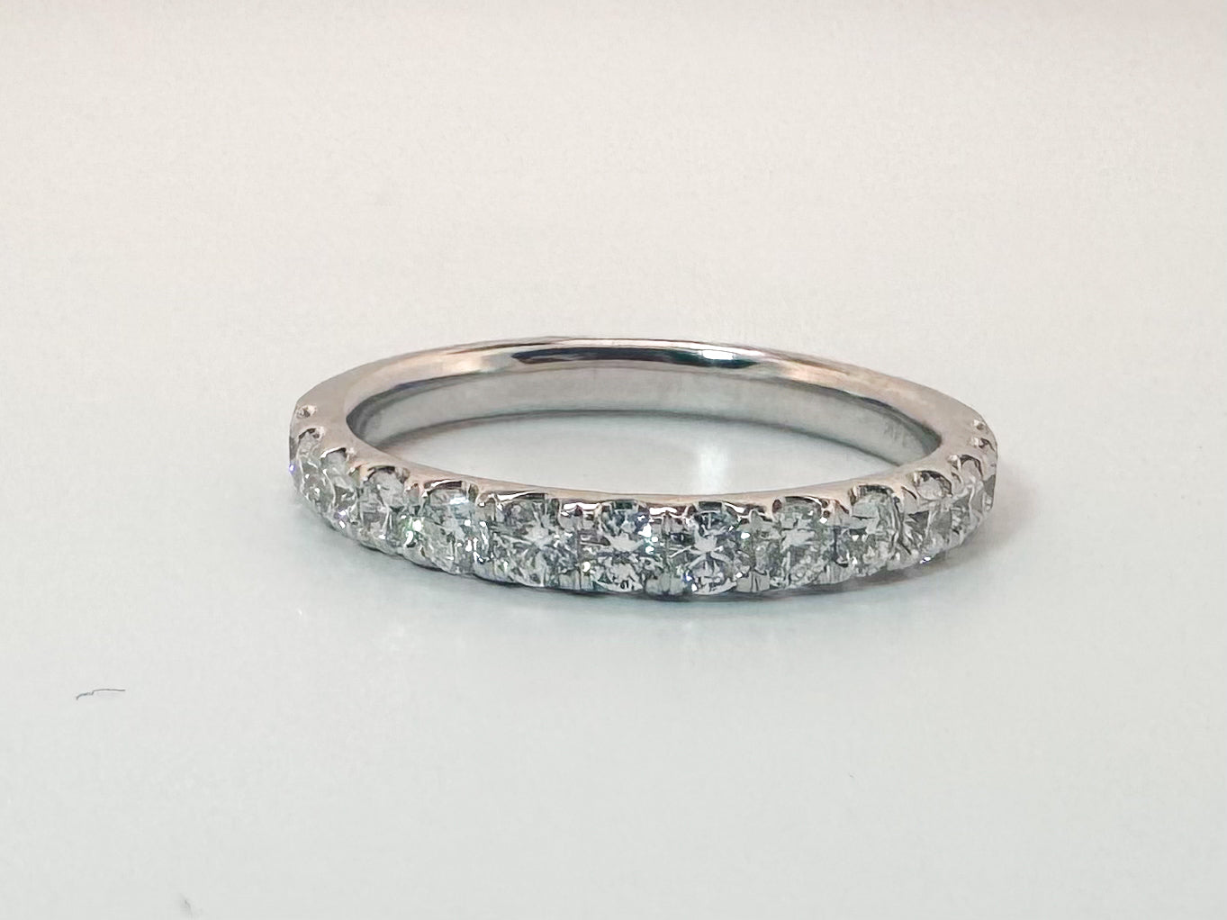 14k, White gold, .65 natural diamond wedding band. VS2 G
