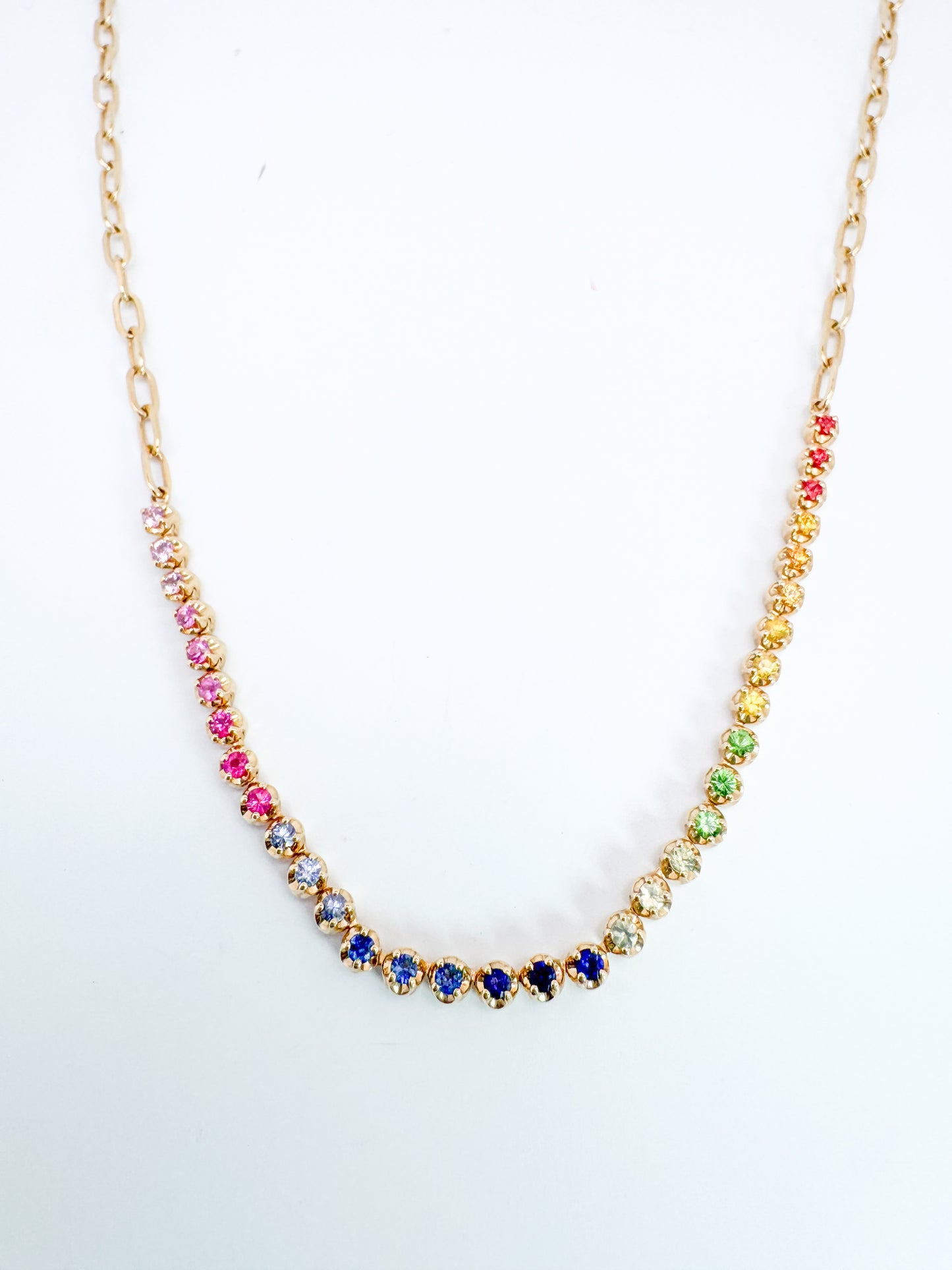 14K,Yellow gold, rainbow sapphire necklace with paperclip chain.
