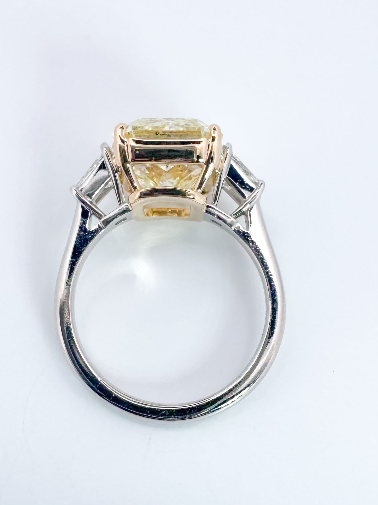 6.07 Natural Fancy light yellow, VS1 , Set in Platinum and 18k with 1.00 carat of side diamond trapezoids.
