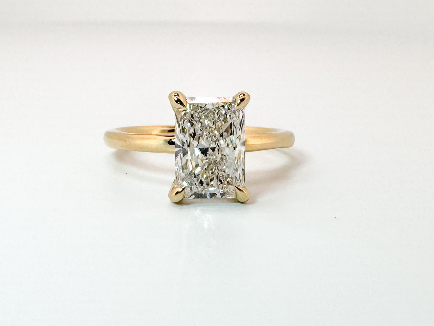 14K, Yellow gold, 2.09 radiant cut lab grown with .08 side diamond IGI Certified VS2 F