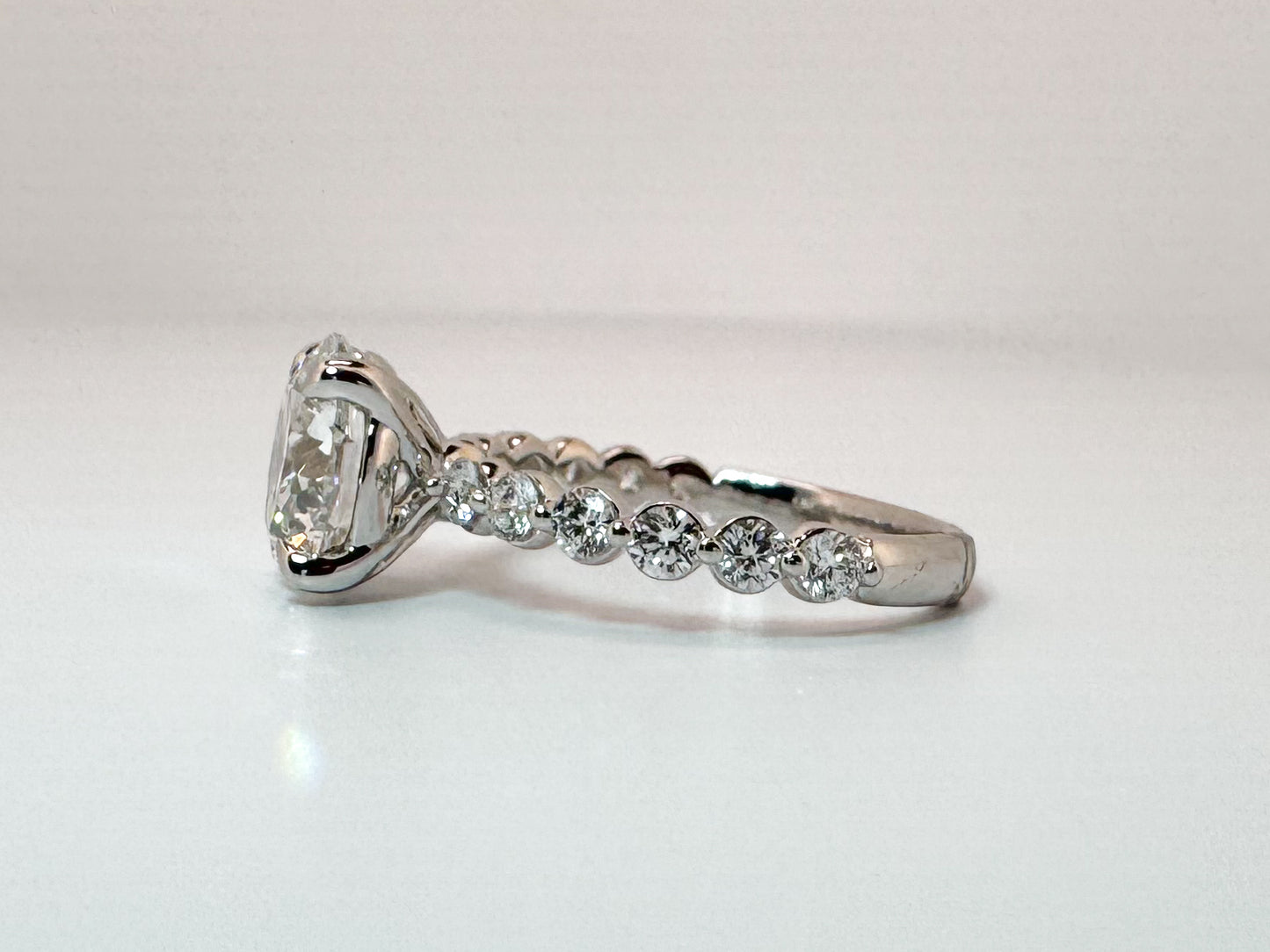 14k, White gold 3.00 carat center VS1 E Ideal cut, set with .55 carats of side diamonds. IGI certified