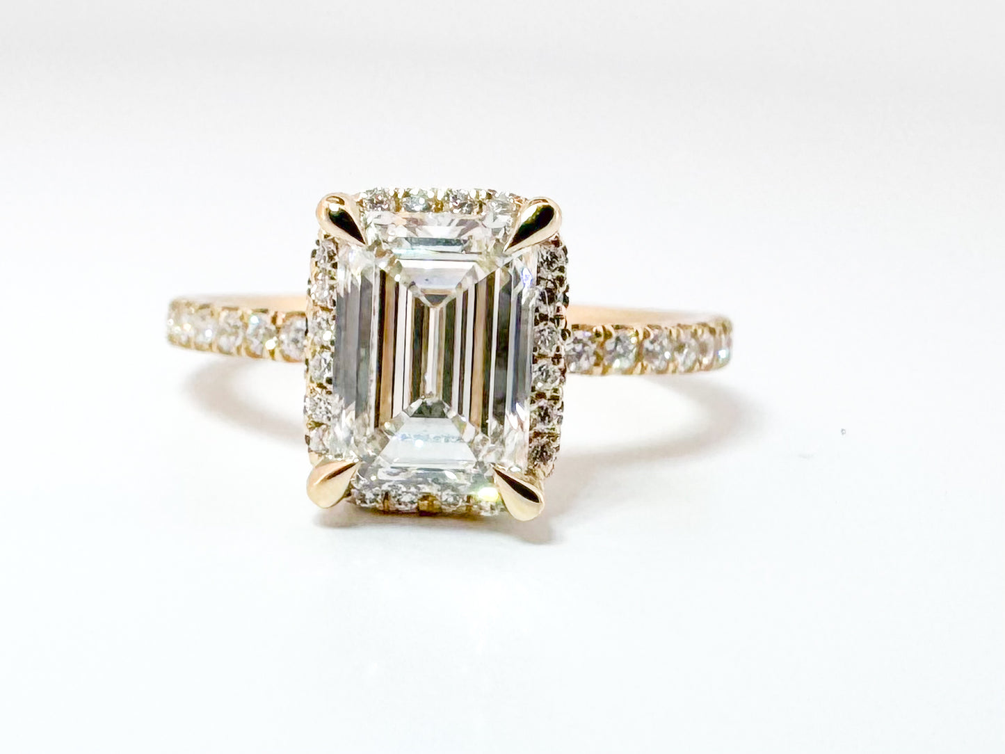 14K, Yellow gold, 2.07 Emerald cut enter set with .40 side diamonds. VS2, F. IGI certified