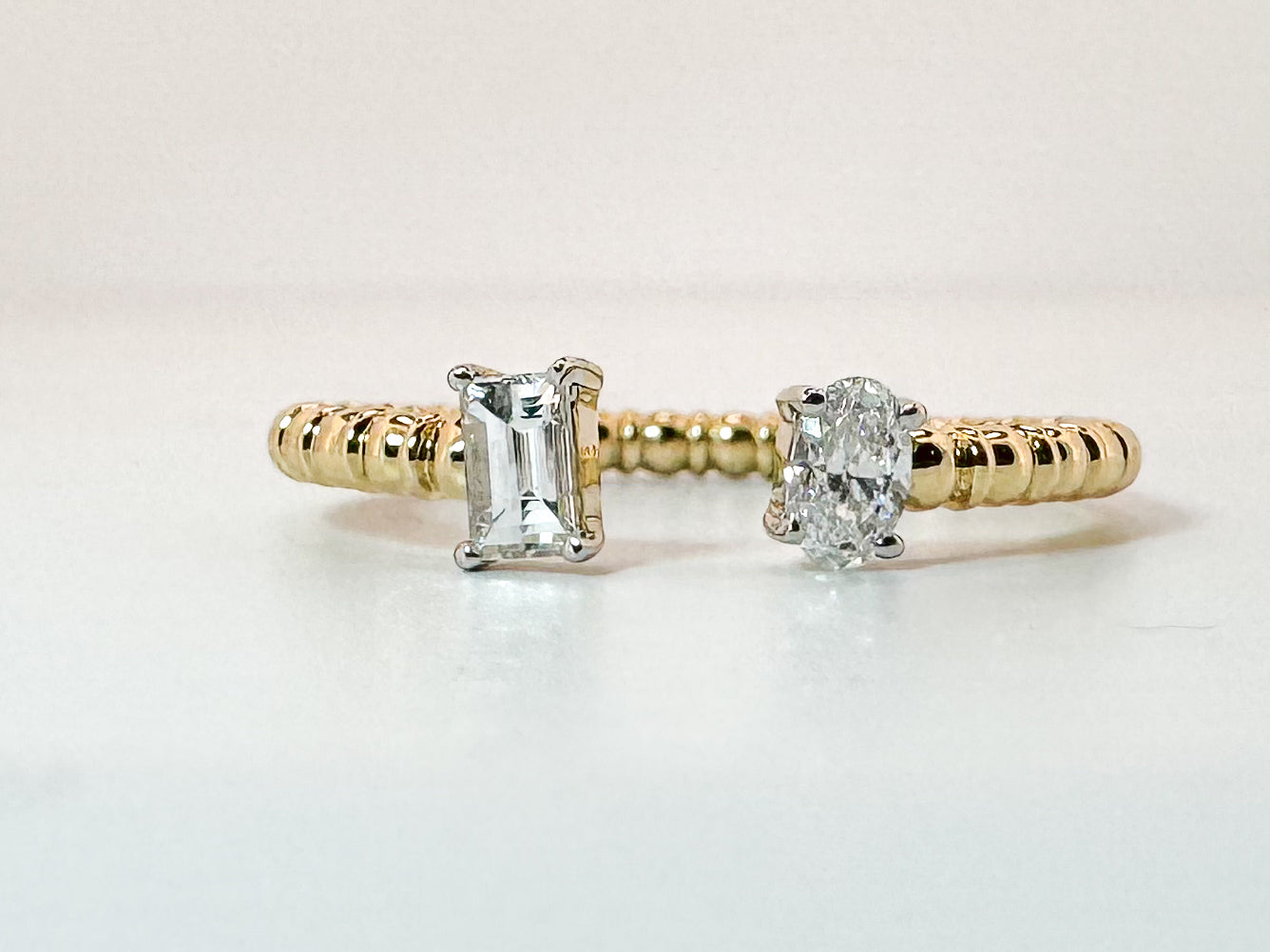 14K, Yellow gold .32 total weight, two diamond ,oval and baguette diamond fashion/ wedding band