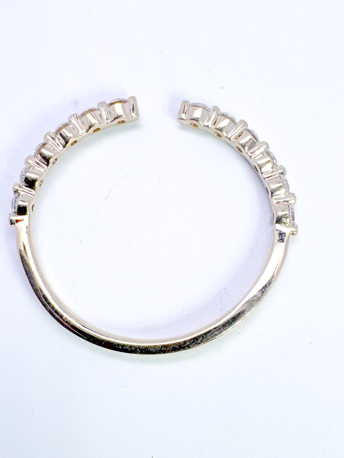 14K, yellow gold open concept, natural diamond band. .24 carat total weight
