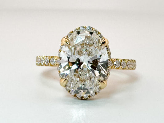 14K, yellow gold, 3.04 carat, Oval lab grown , VS2 F set with .44 carats of side diamonds. IGI certified