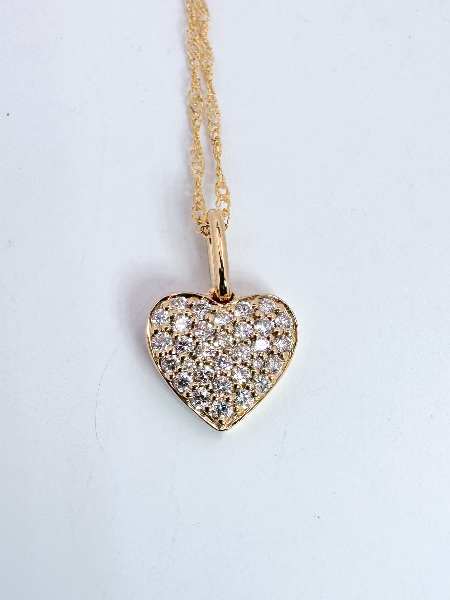 14k, Yellow gold, pave set, mini heart shape natural diamond pendant.