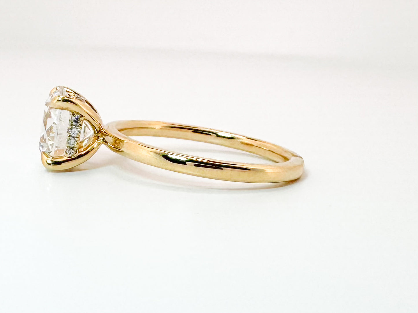 14K, Yellow gold 2.09 carat Ideal cut, round brilliant, set with .08 hidden halo side diamond. IGI certified