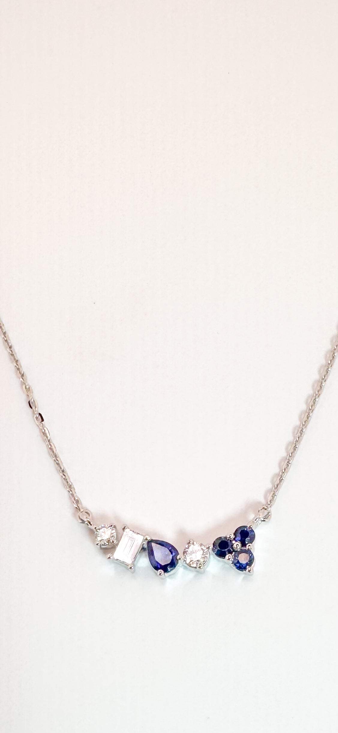 14K, white gold, .18 diamond total weight, .33 carat total weight of natural sapphire. Multi stone necklace