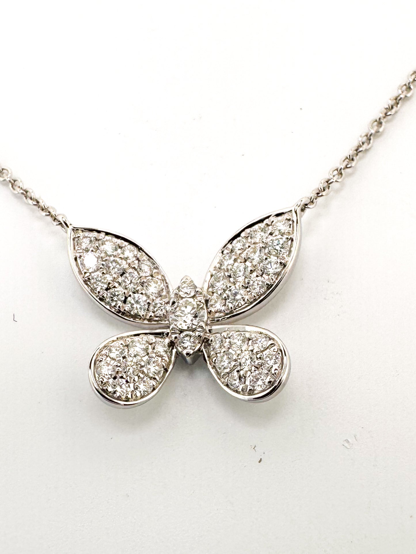 14k, White gold .38 diamond total weight butterfly pendant.