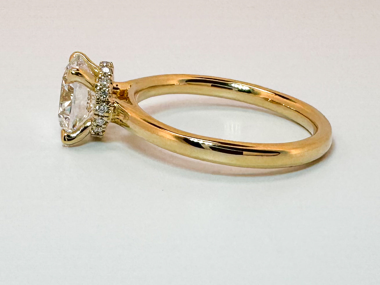 14K, Yellow gold, 2.06 lab grown round brilliant, set with .04 carats of side diamond. IGI CERTIFIED VS1 E
