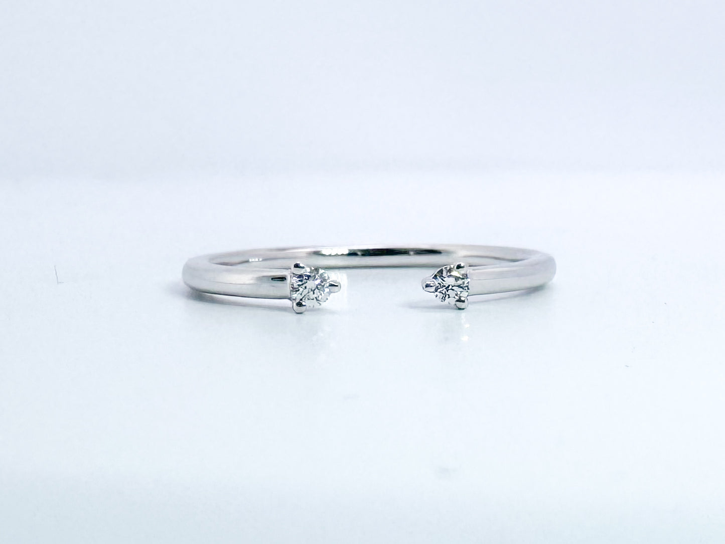 14k, white gold, .05 diamond total weight, open concept band.