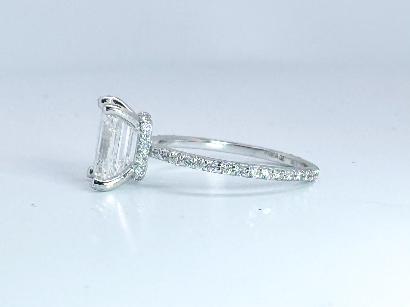 2.05 Natural VS1 E Emerald cut diamond set in classic diamond hidden halo engagemet ring. GIA certified