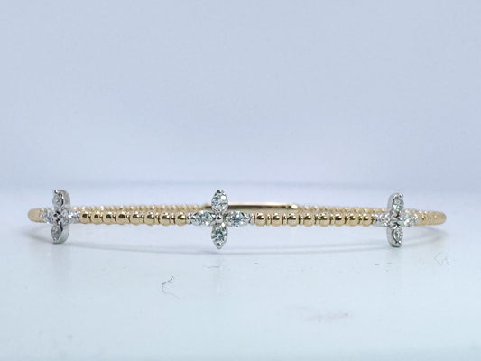 14k, two tone diamond bangle bracelet. .38 carat total weight