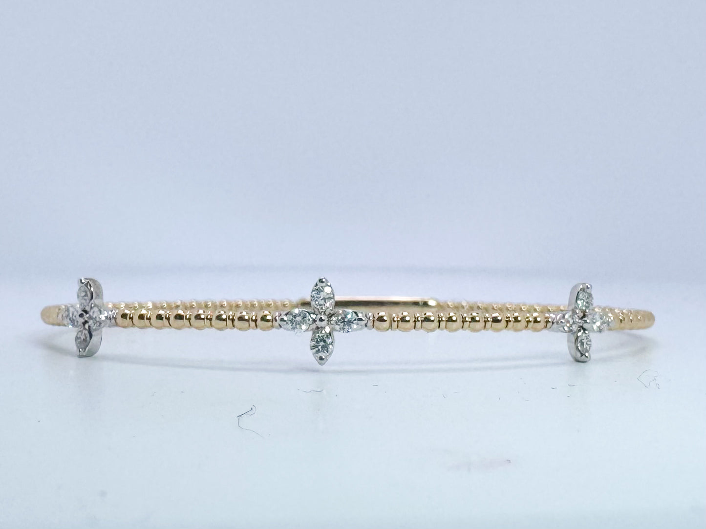 14k, two tone diamond bangle bracelet. .38 carat total weight