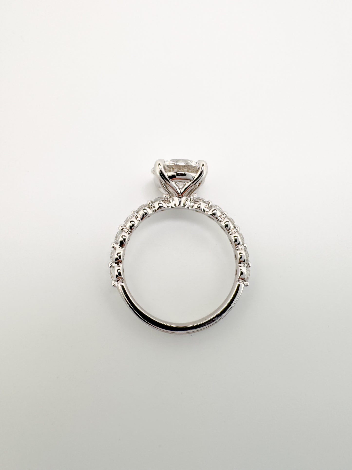 14k, White gold 3.00 carat center VS1 E Ideal cut, set with .55 carats of side diamonds. IGI certified