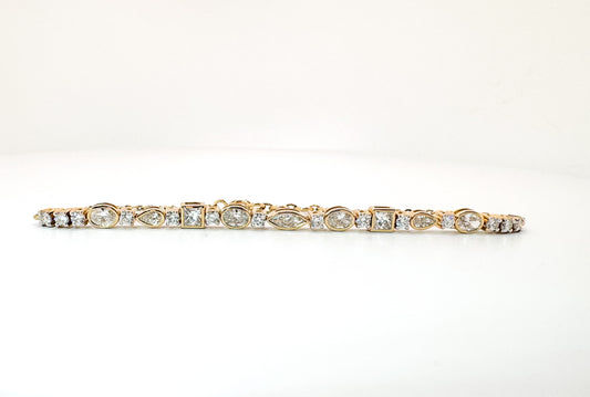 14K, yellow gold, Multi shape, lab grown diamond tennis bracelet. 1.93 carat total weight.
