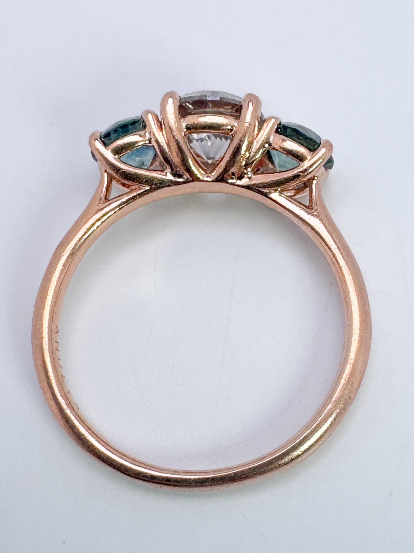 14k, rose gold, 1.02 carat Natural grey diamond set with 1.00 carat total weight natural montana sapphires.