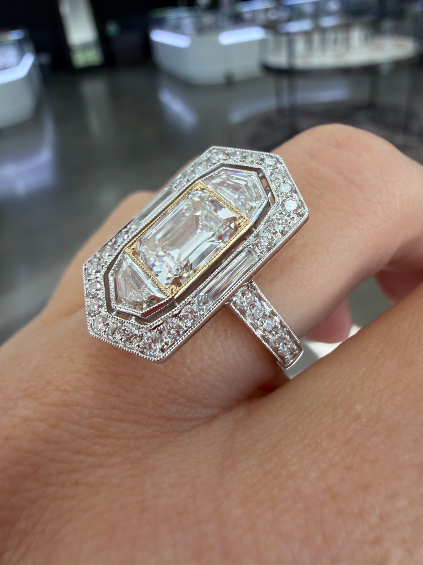 2.05 Natural VS1 E Emerald cut diamond set in classic diamond hidden halo engagemet ring. GIA certified