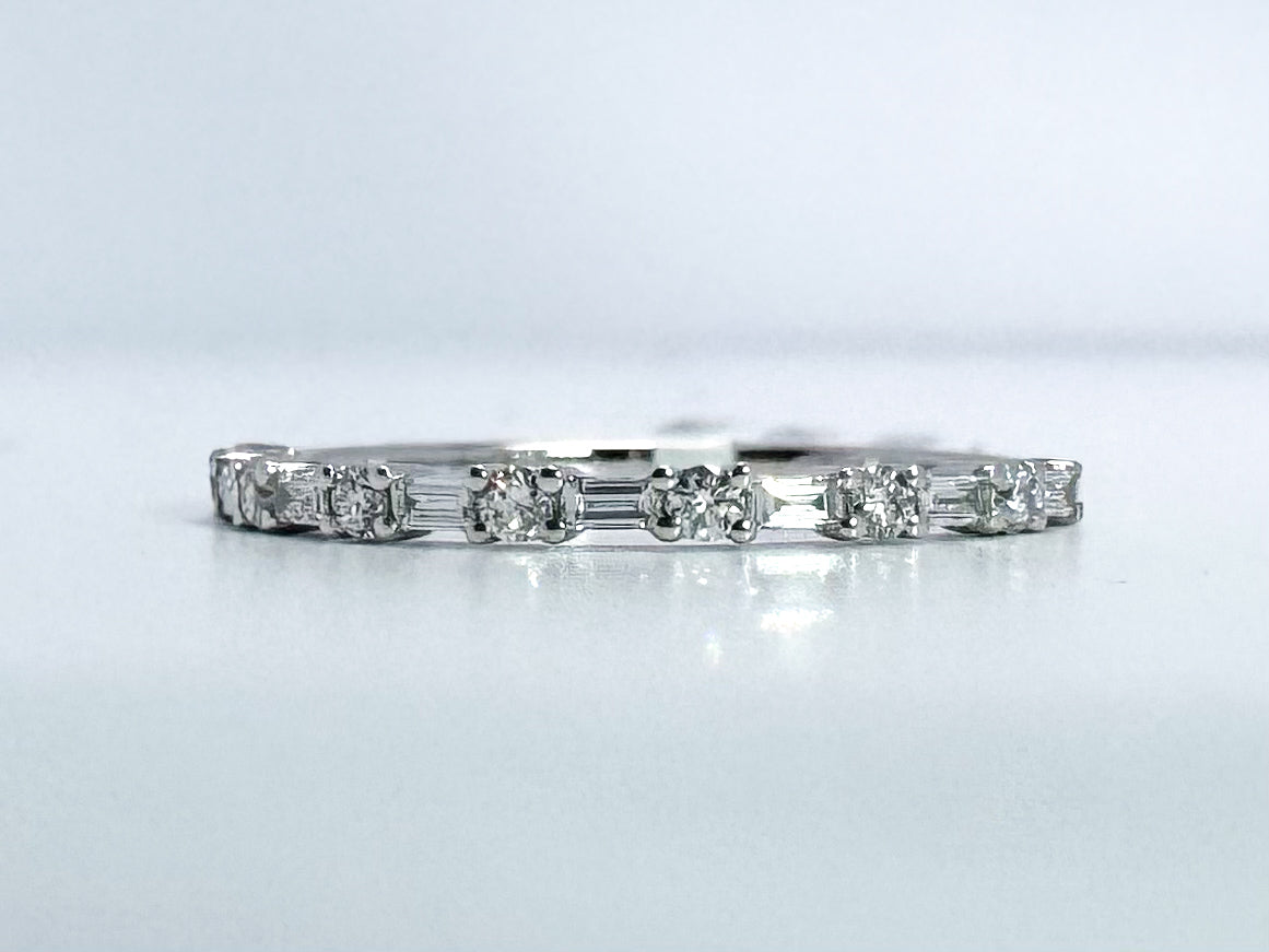14k, White gold .20 dtw baguette and round brilliant diamond wedding band.