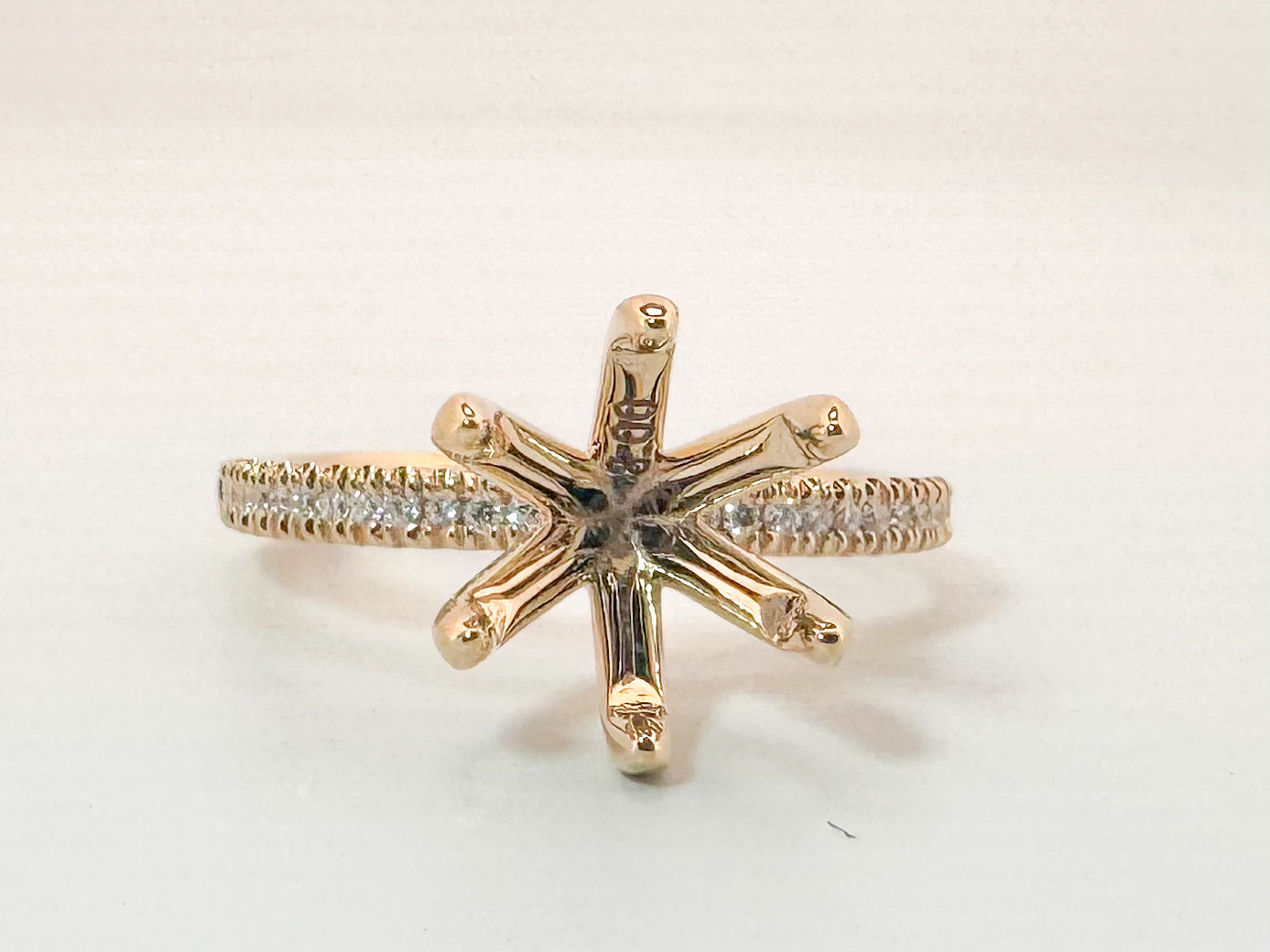 14K, yellow gold .13 side diamond total weight, Semi mount to hold 8mm stone.