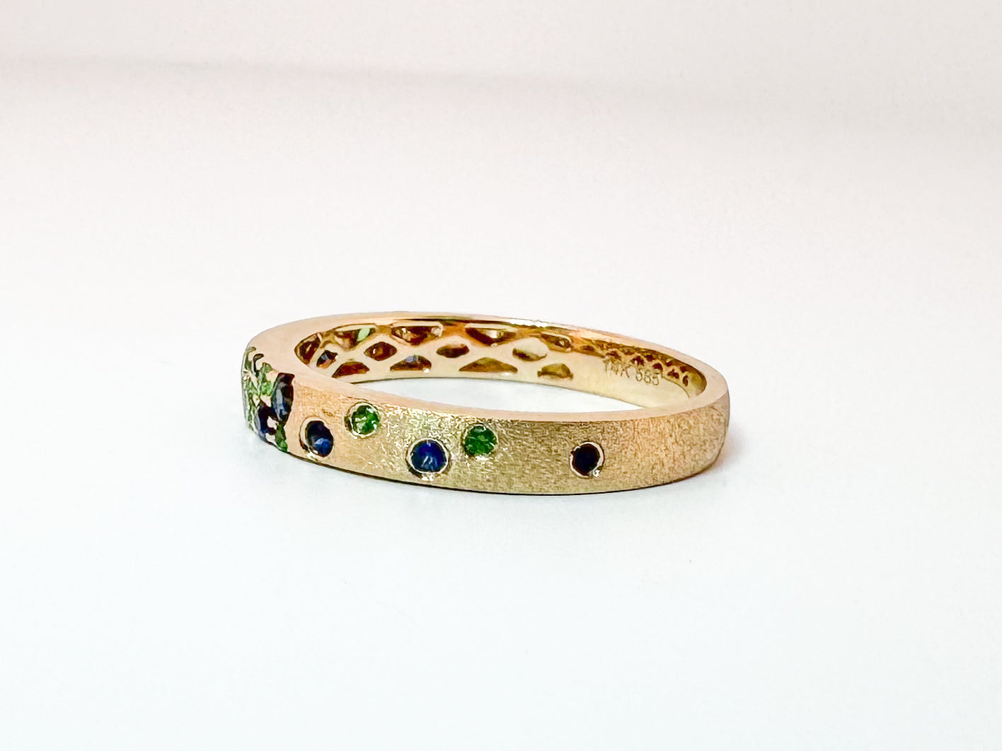 14K, Yellow gold, sapphire and tsavorite garnet fashion band. .37 carat total weight.