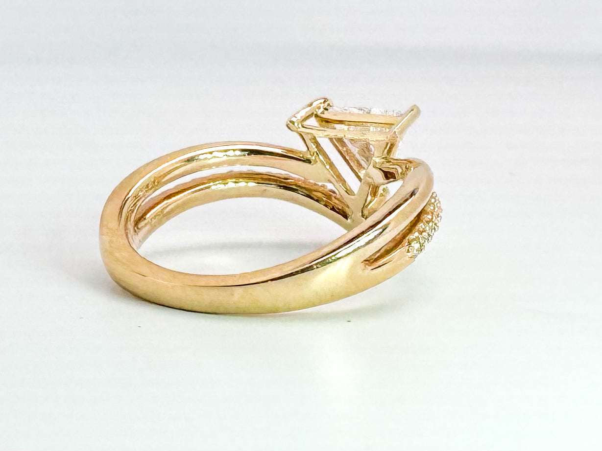 14k yellow gold natural .52 carat trillion diamond set with .16 side damonds