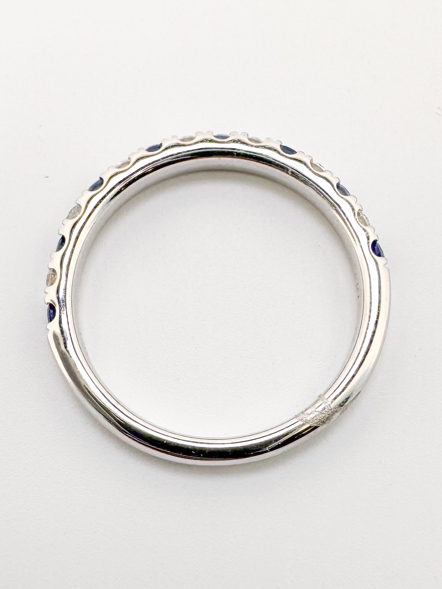 14k, White gold , sapphire and diamond band. .24 ctw diamond/ .48 ctw sapphire