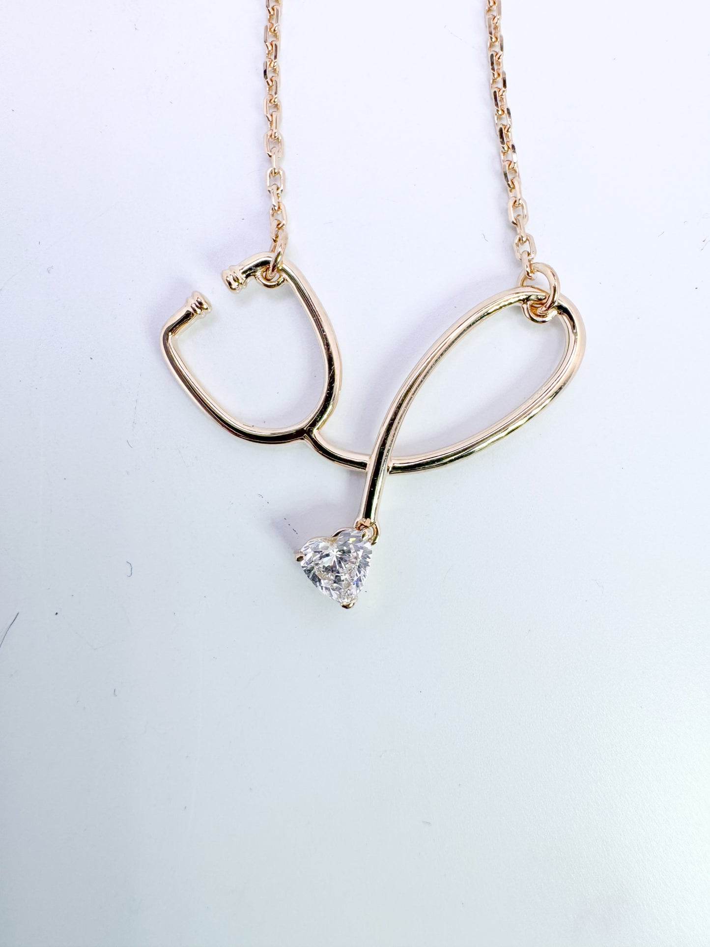 Custom stethoscope pendant, wth .22 ct lab grown heart shaped lab diamond./
