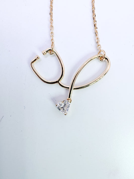 Custom stethoscope pendant, wth .22 ct lab grown heart shaped lab diamond./