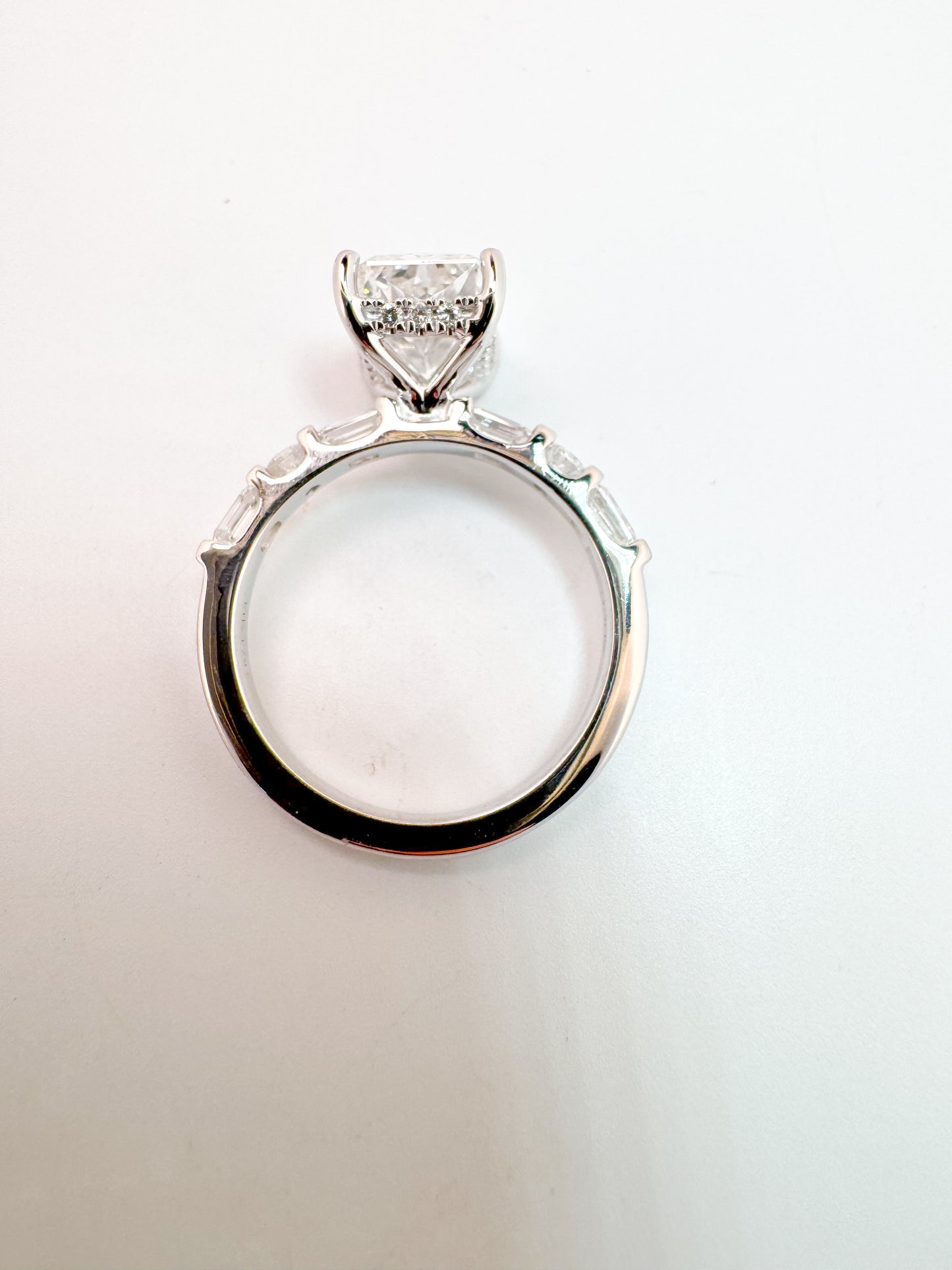 3.05 VS1 E, lab grown radiant cut diamond, set with .87 carats of side diamonds. IGI certified