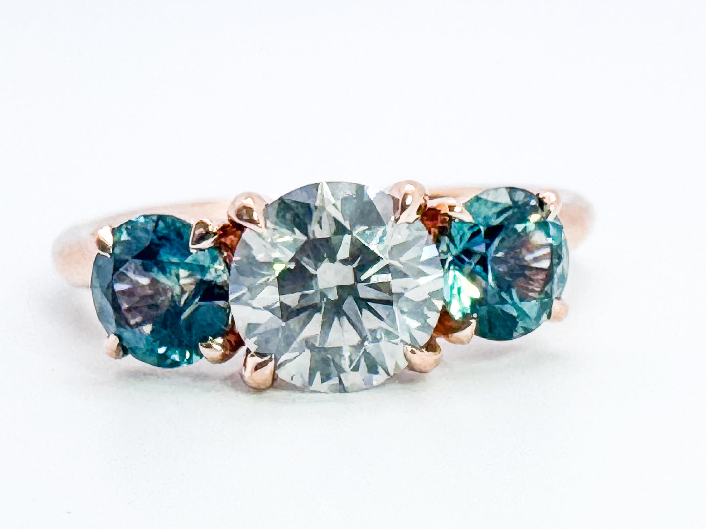 14k, rose gold, 1.02 carat Natural grey diamond set with 1.00 carat total weight natural montana sapphires.