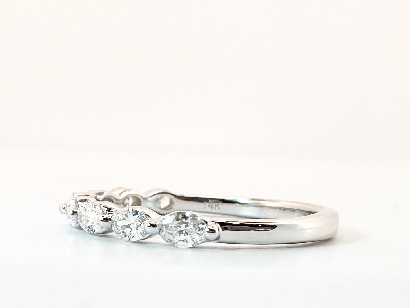 14K, White gold, .60 carat total weight, side ways oval band. VS2 G