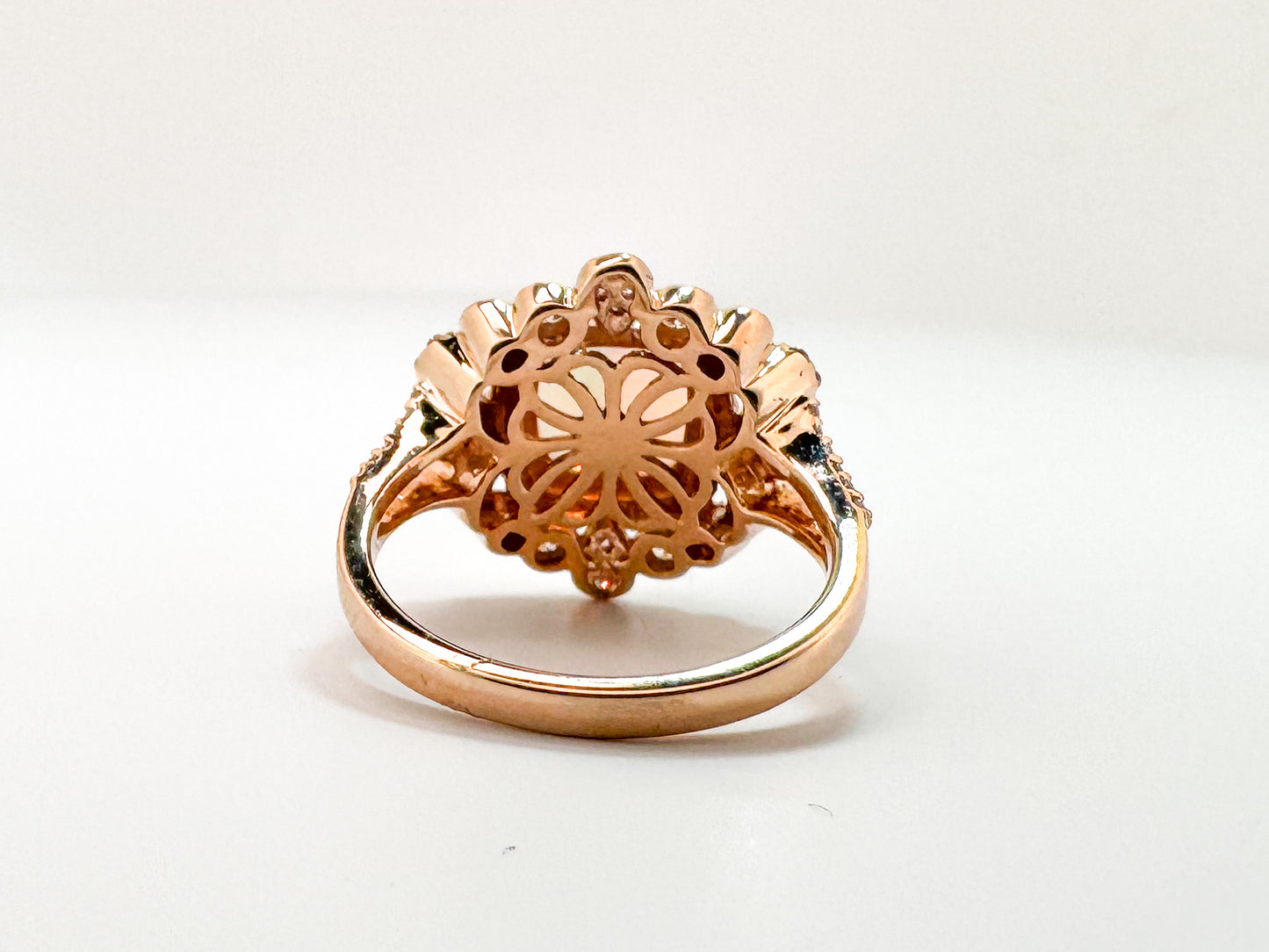 14k, Rose gold, 1.40 carat Ethiopian opal set with .60 carats of side diamonds.