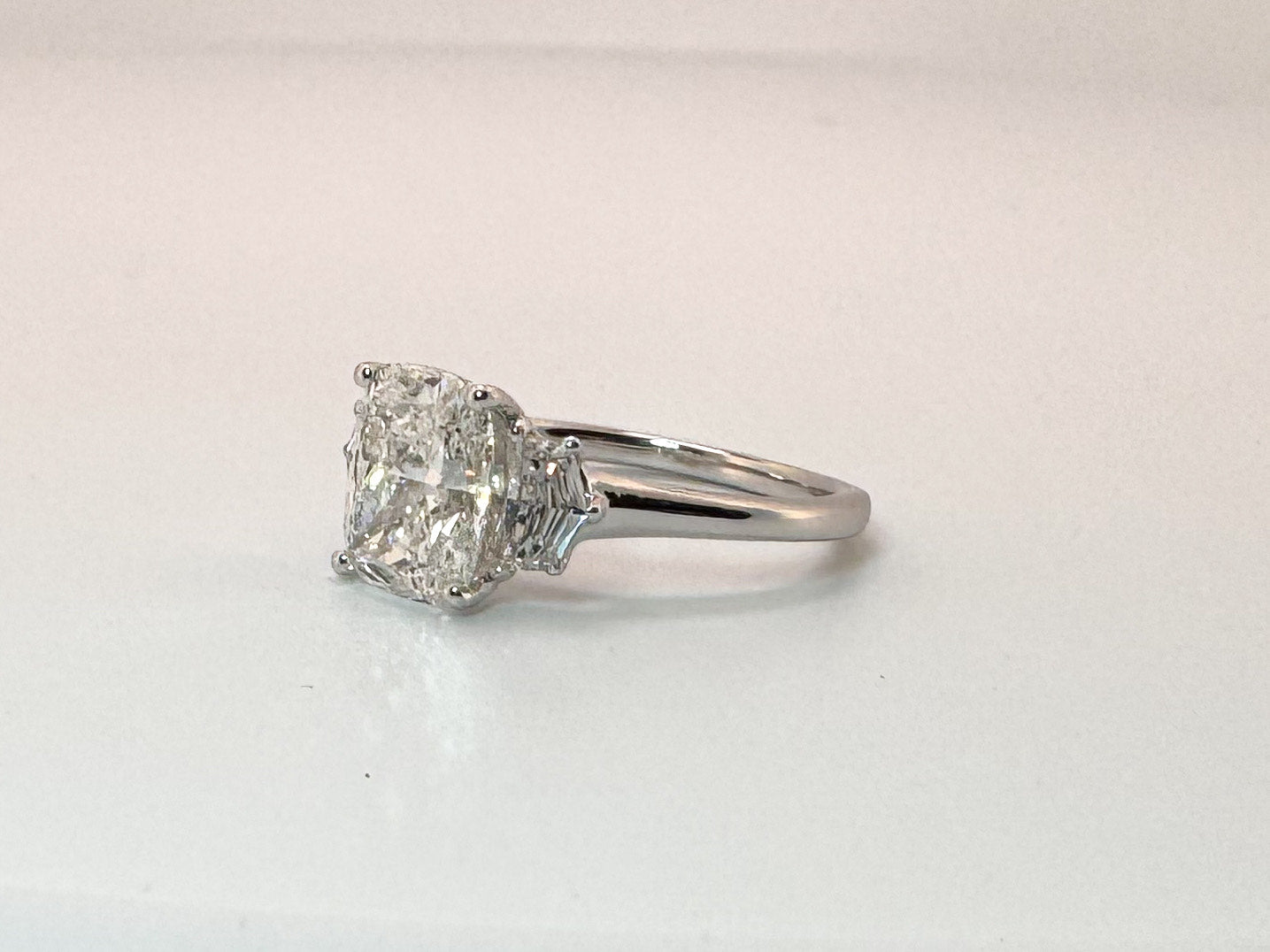 14kw 2.54 lab grown  cushion cut center , set with .54 total weight Epaulette cut side diamonds.