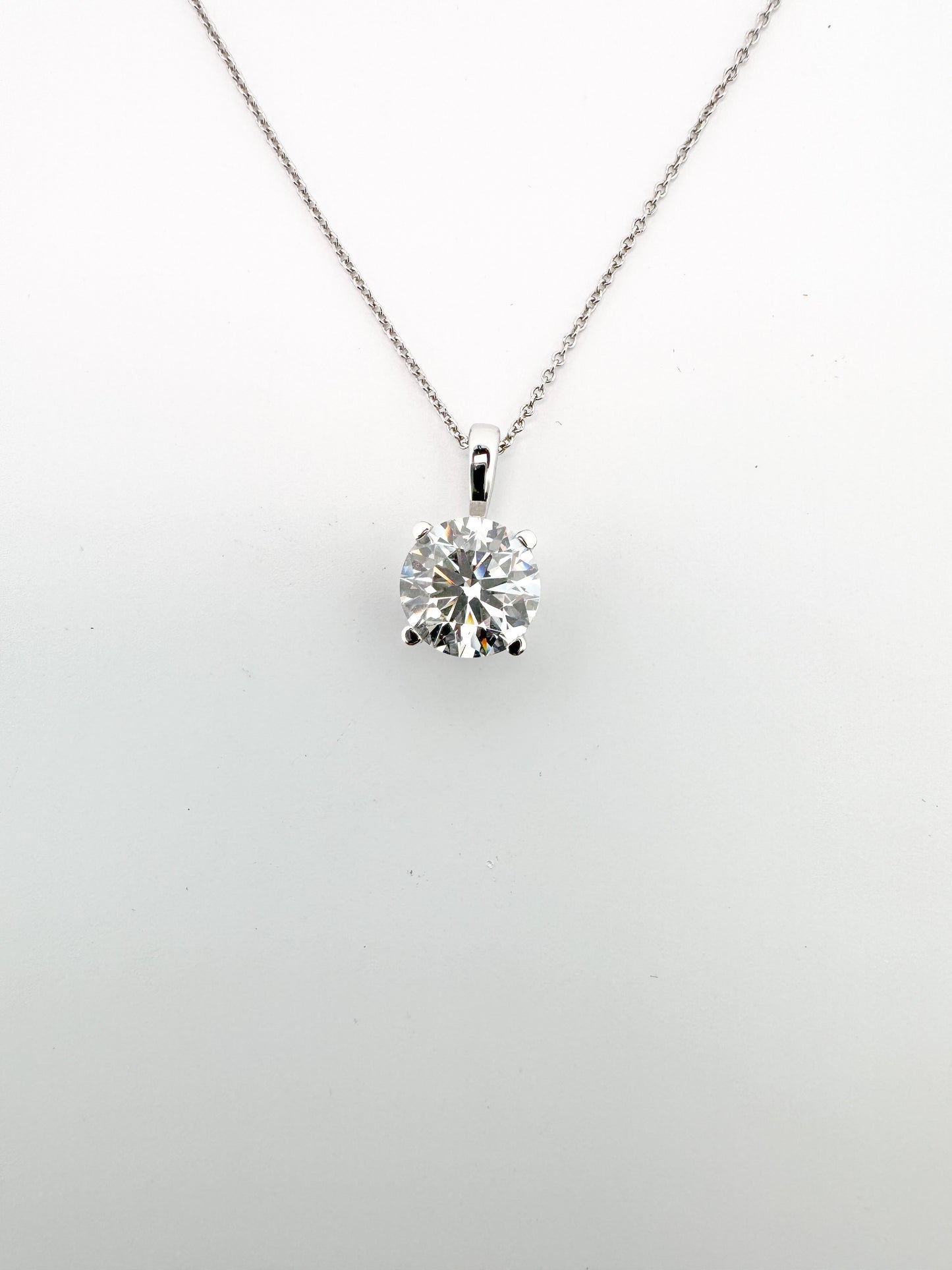 14K, whtie gold 3.02 carat lab grown round brilliant solitaire pendant. VVS2 G