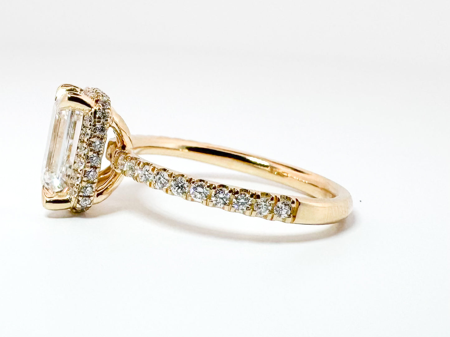 14K, Yellow gold, 2.07 Emerald cut enter set with .40 side diamonds. VS2, F. IGI certified