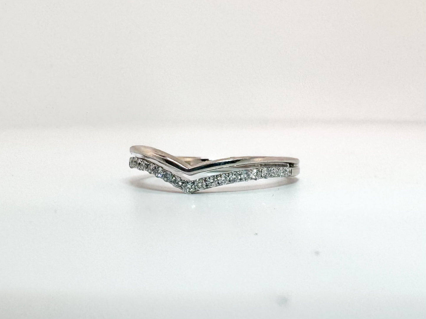 14k, White gold, .15 carats of natural diamonds. Wedding band.