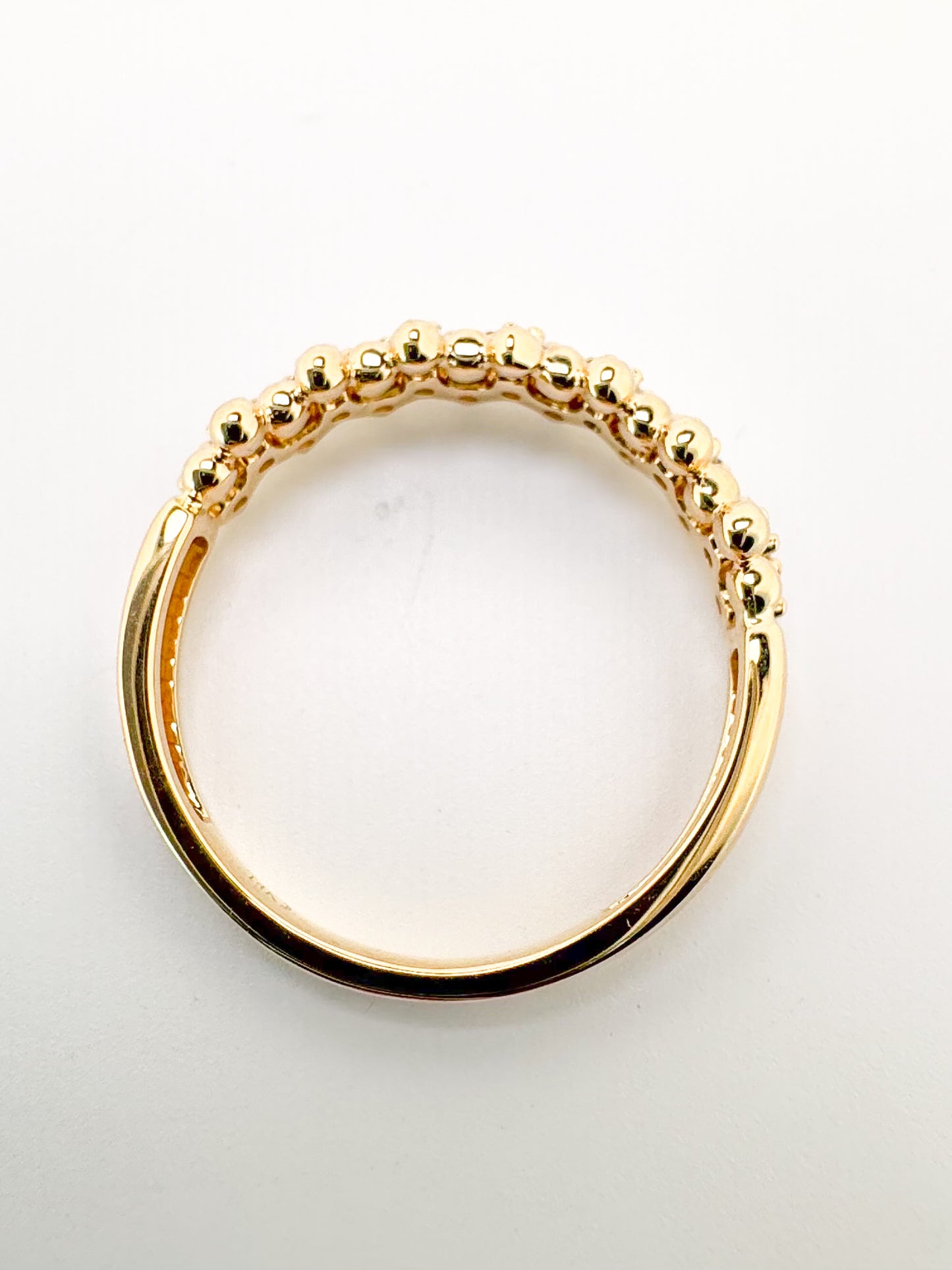 14K, yellow gold jaggad diamond band. .33 diamond total weight.