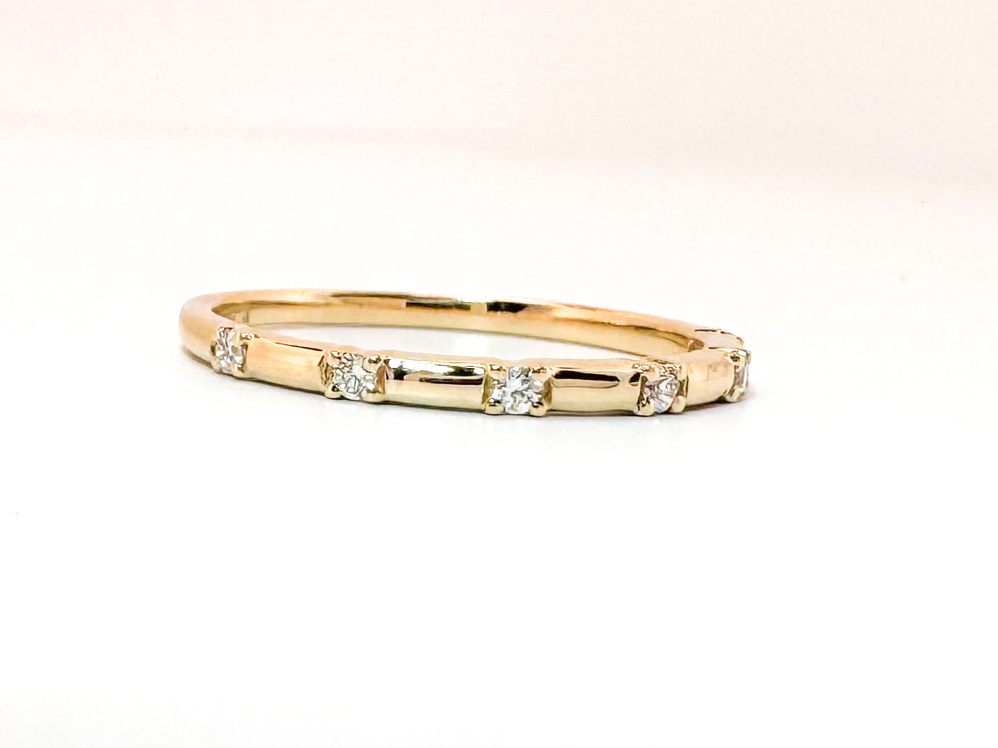 14k, yellow gold .06 diamond total weight, wedding band.