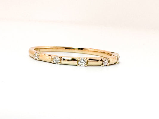 14k, yellow gold .06 diamond total weight, wedding band.
