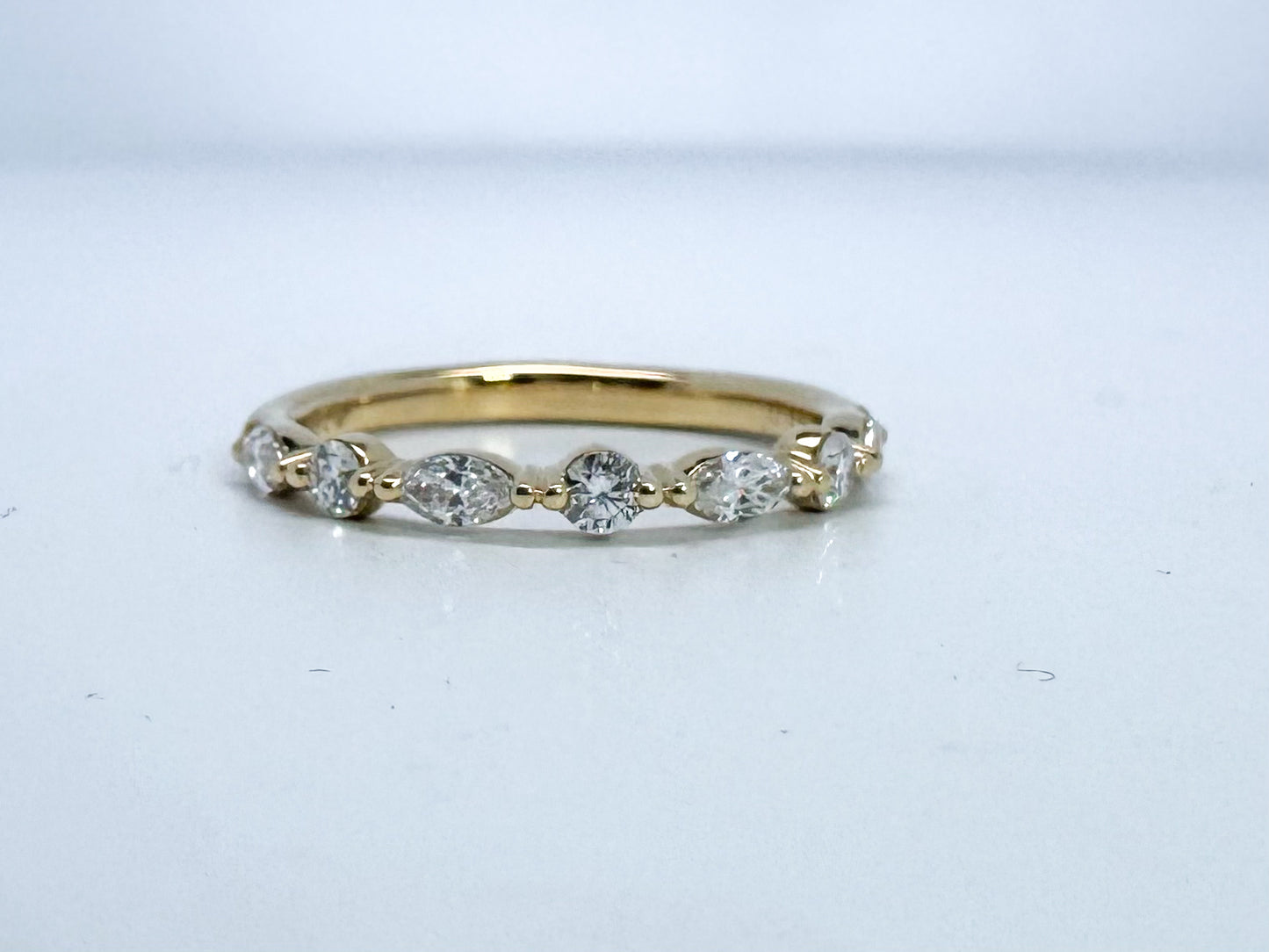 18k, yellow gold, alternating marquise and round brilliant diamond band. .43 carats.