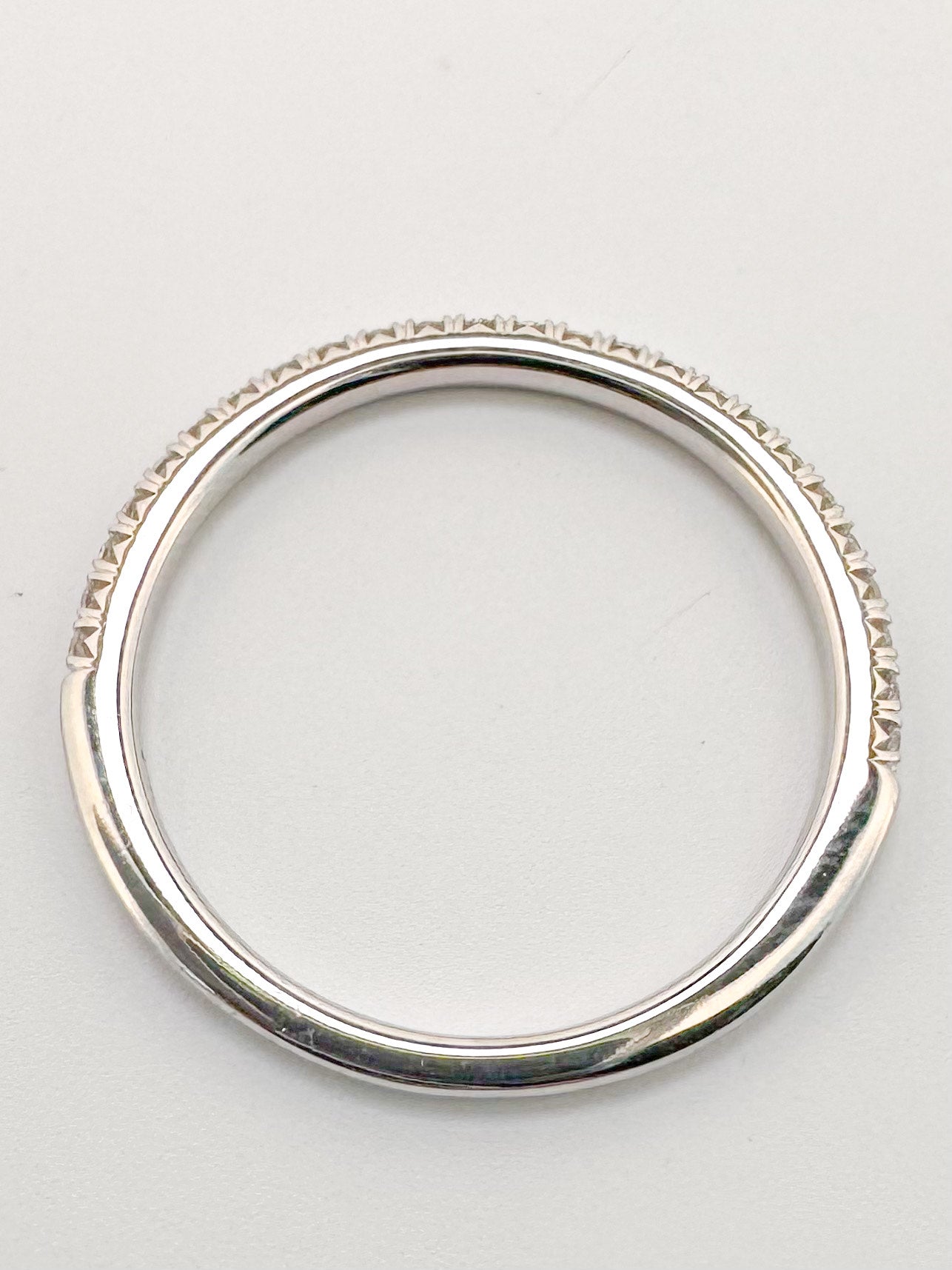 14K,. White gold .15 carat total weight natural diamond wedding band