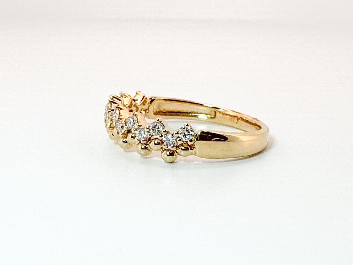 14K, yellow gold jaggad diamond band. .33 diamond total weight.