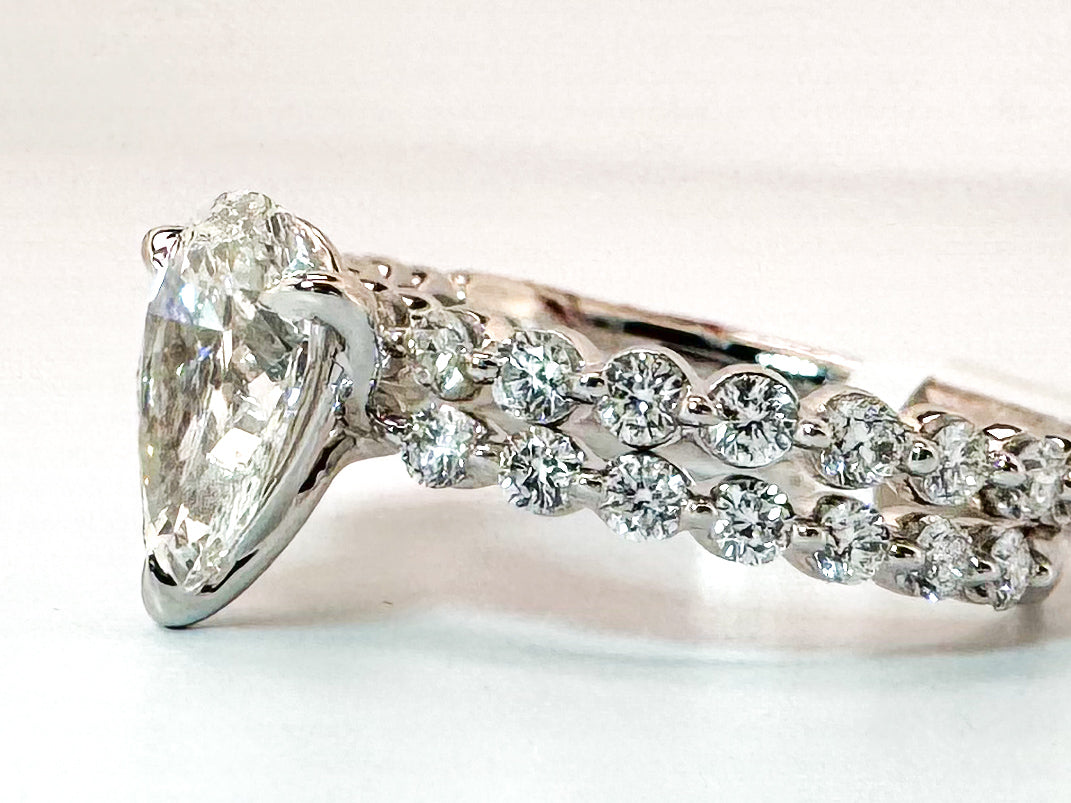 14k, White gold, lab diamond engement ring. 1.23 Pear shaed center with .72 side diamonds.