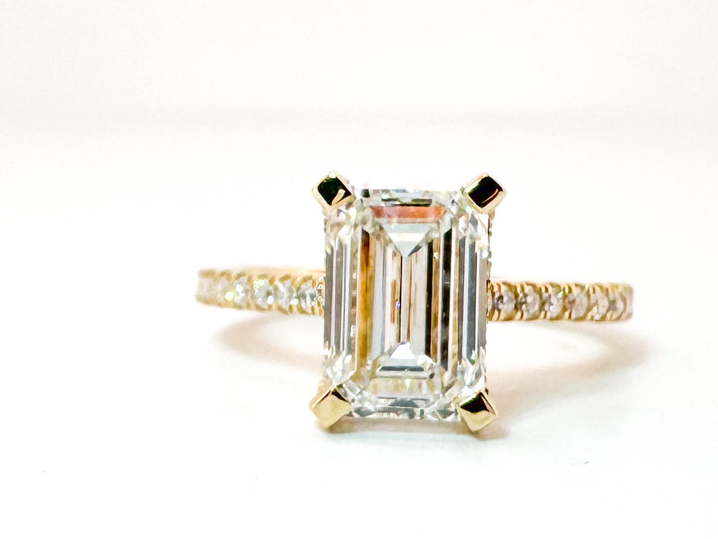 14K,Yellow gold 2.51 carat, Lab grown, emerald cut diamond set with .30 side diamonds. IGI Certitied VS1 E
