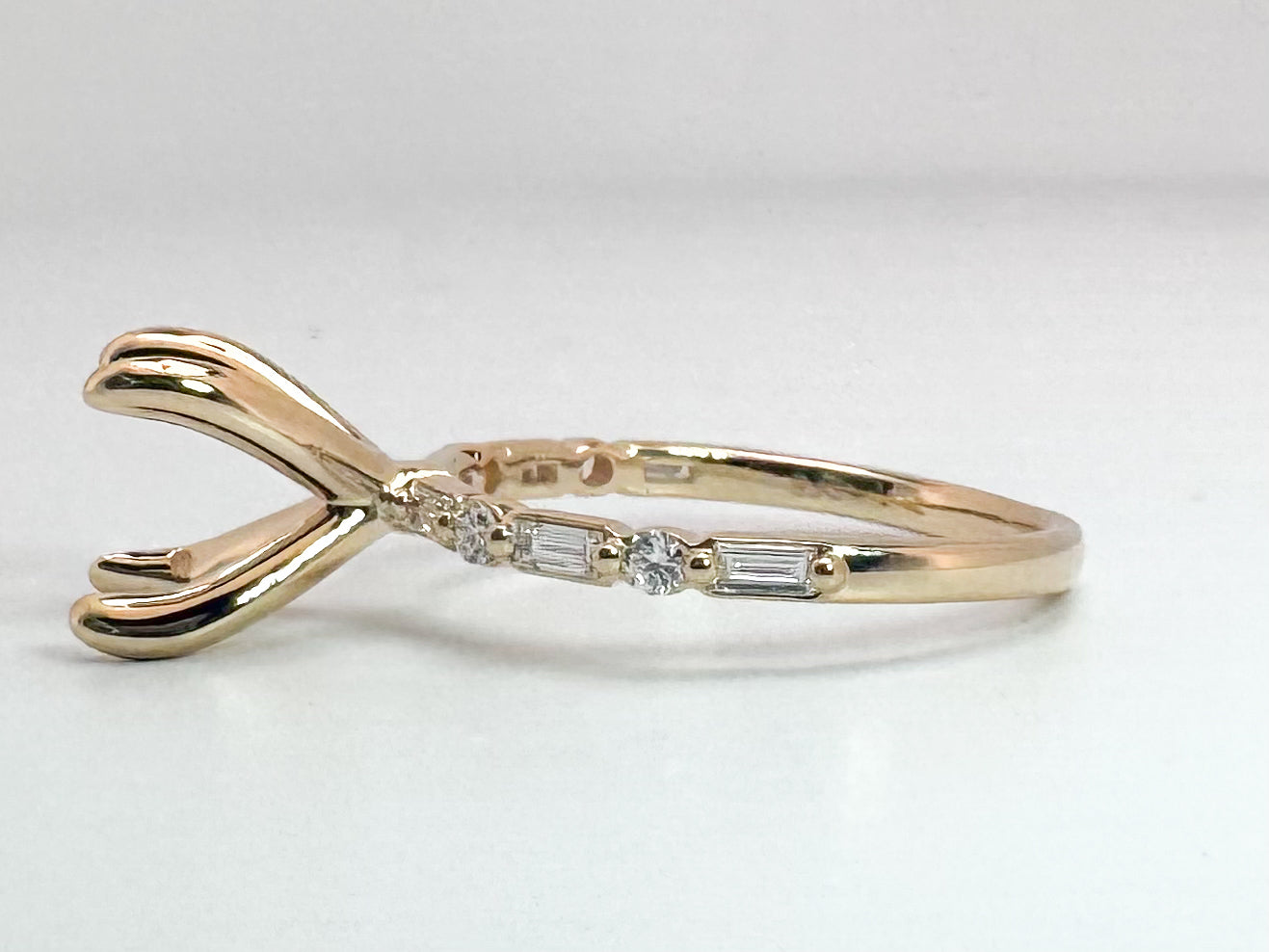 14k, yellow gold,.25 diamond total weight, baguette and round brilliant engagment ring.