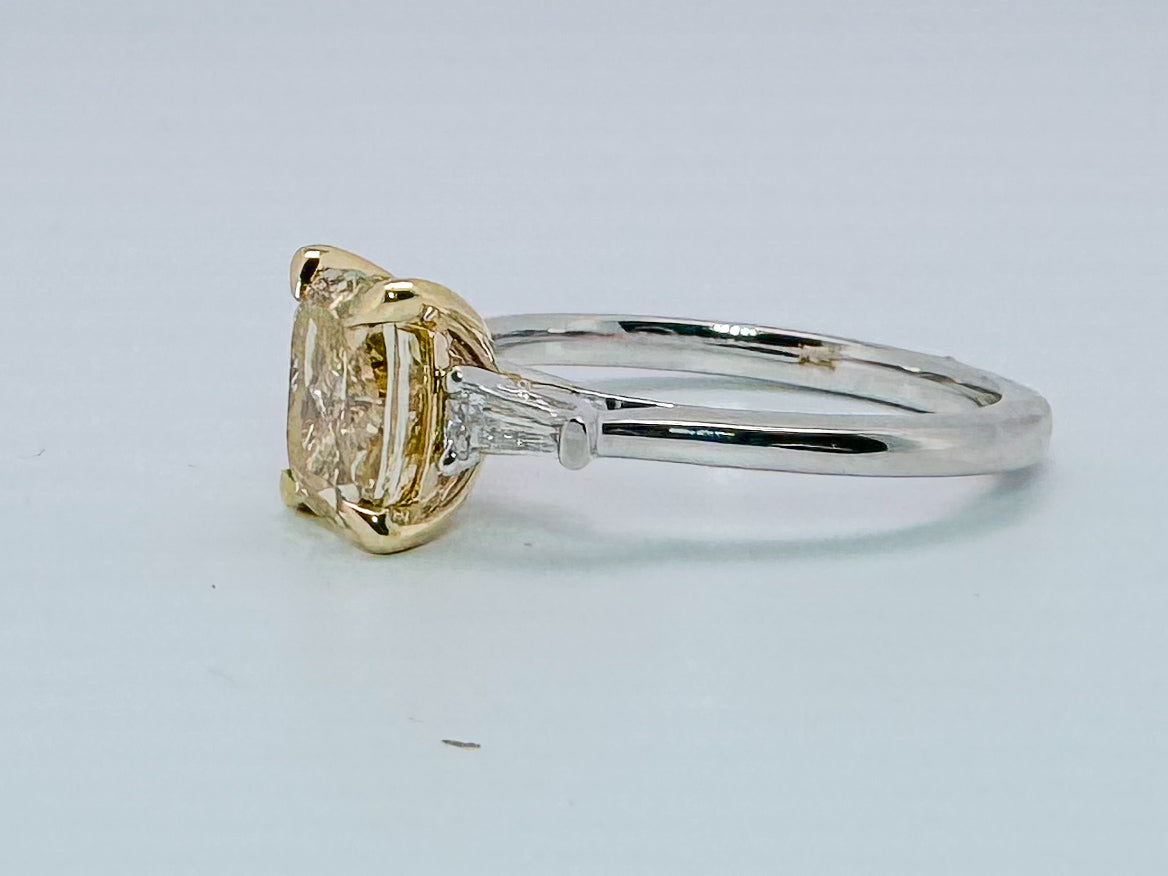 14K two tone 1.62 VS2 fancy intense yellow set with .09 total weight baguettes. Lab grown